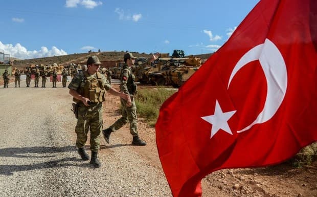 Turkish soldiers near Turkey’s border with Syria’s Idlib on Tuesday. Photo: Ilyas Akengin/AFP
