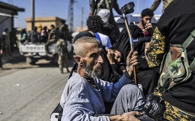 Syrian civilians on Raqqa’s western front after fleeing the city centre on Thursday. Photo: Bulent Kilic/AFP