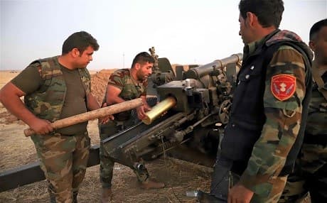   Peshmerga fighters load an artillery at the Altun Kubri checkpoint, 40kms from Kirkuk, on October 20, 2017. Photo: AFP / Marc-Antoine Pelaez