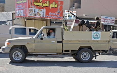 A picture taken on October 20, 2017 shows a pickup truck bearing the logo of Iranian-backed  Hashed al-Sahaabi militia carrying a fighter manning an anti-aircraft turret, in the region of Pirde or Altun Kupri, about 50 kilometres (30 miles) from Erbil where Iraqi forces heavily clashed with Kurdish peshmerga. Photo: AFP/ Marwan Ibrahim