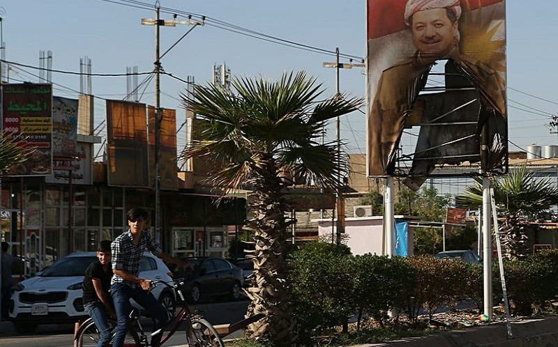 A scorched poster of Kurdistan Region President Masoud Barzani in Kirkuk on Thursday. Photo: Khalid Mohammed/AP