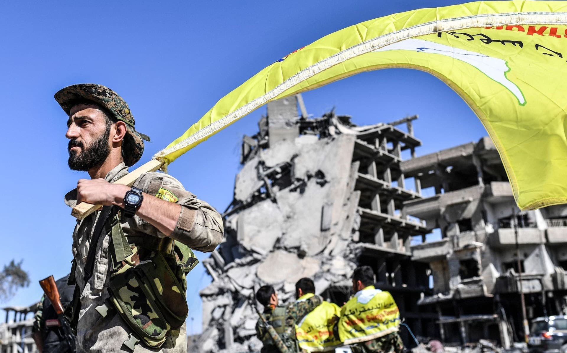 A member of the SDF in Raqqa's al-Naim square after announcing the city's liberation from ISIS last week. Photo: Bulent Kilic/AFP