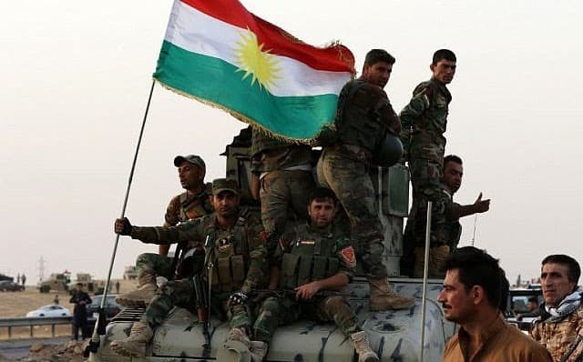 Peshmerga guard a checkpoint at Pirde (Altun Kupri) on October 16. Photo: Safin Hamed/AFP