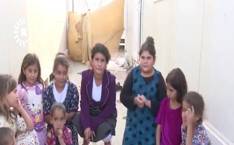 A group of schoolgirls from Tuz Khurmatu deprived from studying in Kurdish language after they fled home fearing abuses at the hands of Iran-backed Shiite militia groups sitting helplessly at a refugee camp in Garmiyan, Kurdistan Region. Photo :Rudaw video 