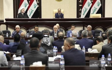 Prime minister Haider Al Abadi, centre, attends a session of the Iraqi parliament in Baghdad. Photo: AP/Karim Kadim