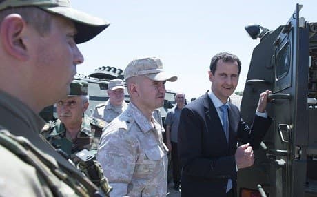 Syrian President Bashar al-Assad [R] stated on November 10, 2017 that his government will wage war on any group that aims to divide or weaken the Syrian state. File photo: Syrian presidency