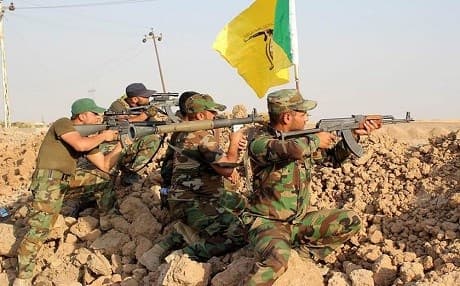 Militiamen in Iraq fight under the banner of Kataib Hezbollah. Photo: AP