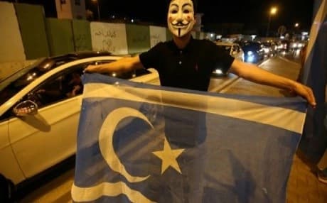 An Iraqi waves the Turkmen flag in Kirkuk to celebrate after Iraqi government forces took the ethnically mixed city from Kurdish peshmerga fighters earlier on October 16, 2017. File photo: AFP/Sarah Benhaida 