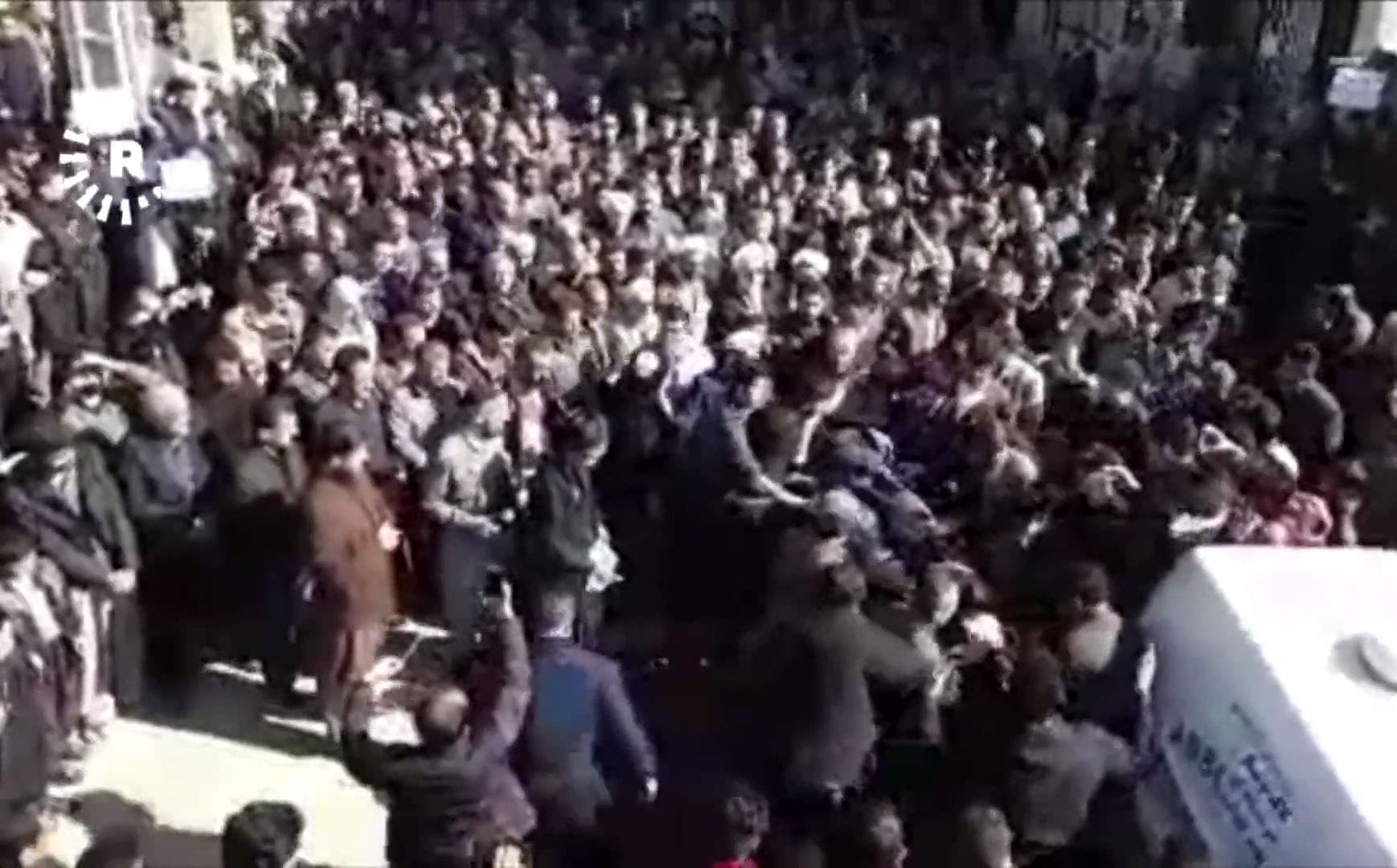 Mourners receive the body of Abubakr Maroufi in Javanrud. Photo: Rudaw video