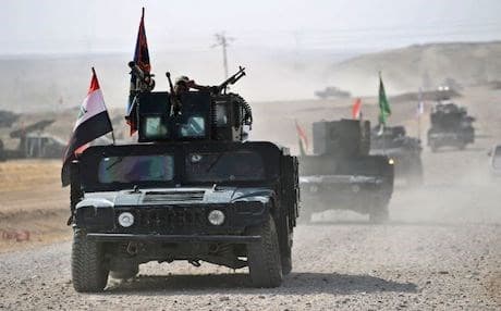 Iraqi forces including Iran-backed Hashd al-Shaabi militia advance towards the town of Fishkhabur, on the Turkish and Syrian borders on October 26, 2017. Photo: AFP/ Ahmad al-Rubaye  
