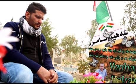 File photo shows Sivar Khalil as he visits the grave of his brother, Hajar, who was killed when run over by an Iraqi tanks in Kirkuk on October 16, 2017. His family relied on DNA test to identify the fallen Peshmerga. File photo:Rudaw TV