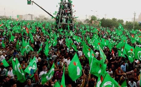 PUK supporters wave their party’s green flag during an election campaign in Erbil. Photo: Rudaw