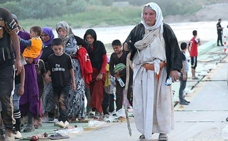A number of Yezidi women and children flee ISIS near the border of Syria. File photo: Rudaw