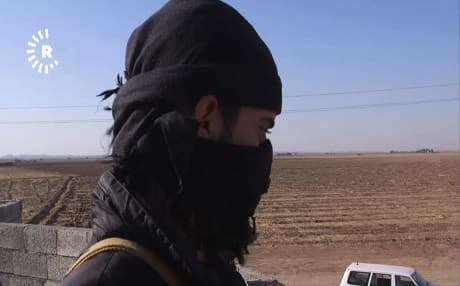A Kurdish fighter who belongs to a group that calls itself "Liberation Army" stands guard in a village east of Tuz Khurmatu. The Kurdish group say they do not know the identity of the unknown group stationed near their positions. File photo: Rudaw TV