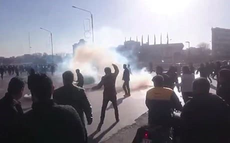 Demonstrators protest in Mashhad in eastern Iran on Thursday. Photo: Iranian state TV