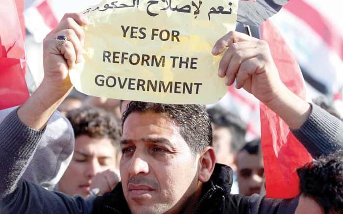 An anti-corruption protester demonstrates in Baghdad’s Tahrir Square. File photo: AFP