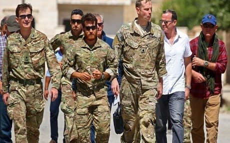 Brett McGurk, second from right,US special presidential envoy for the Global Coalition against ISIS, arrives in the liberated town of Tabqa, west of Raqqa, Syria in July 2017. Photo: AFP