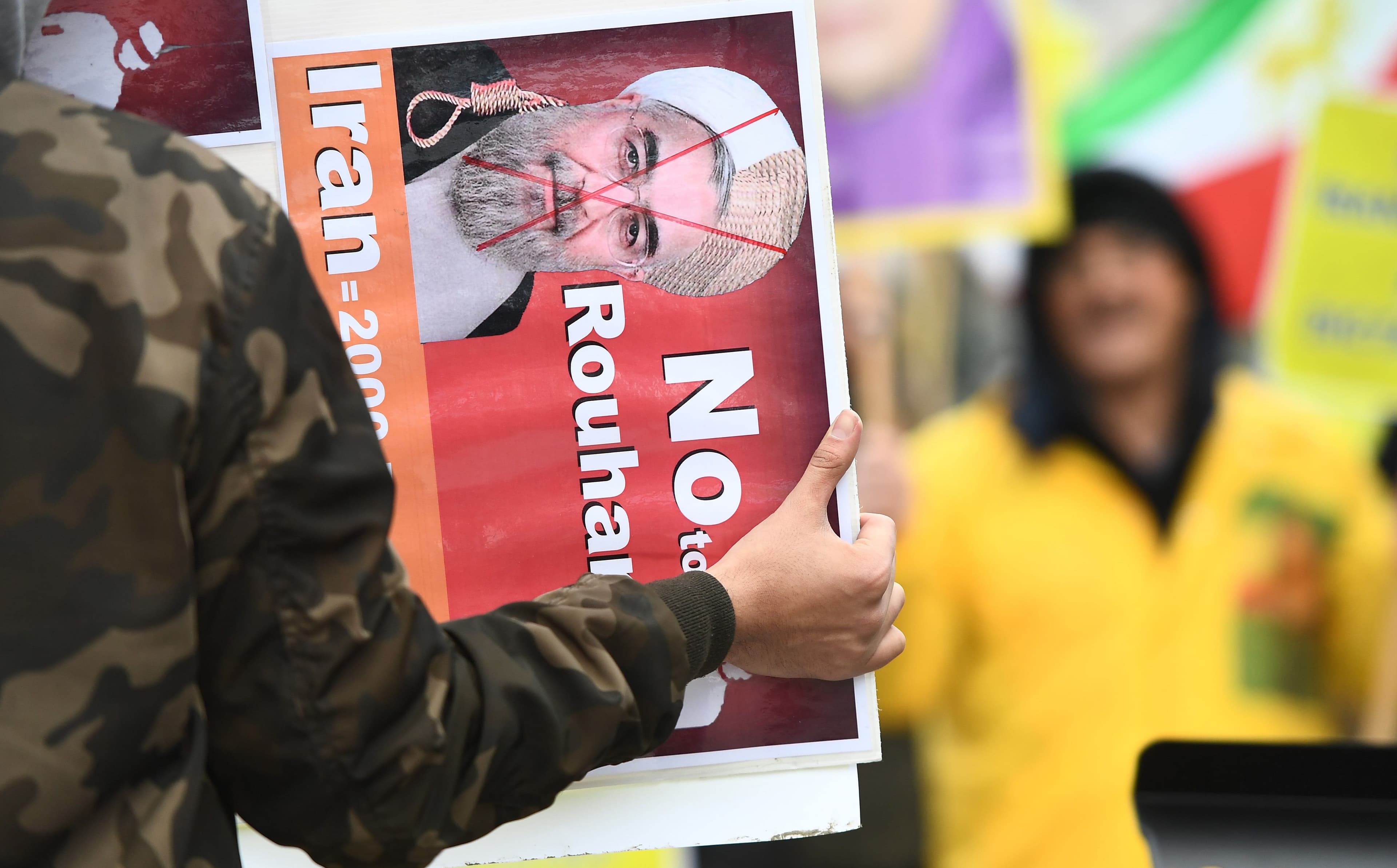 A protester participates in a demonstration in Brussels on Wednesday in support of anti-government protests in Iran. Photo: Emmanuel Dunand/AFP