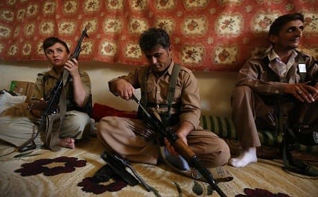 KDPI fighters maintain their rifles as part of a military exercise near Koye, Kurdistan Region, on August 23, 2017. Photo: Safin Hamed | AFP