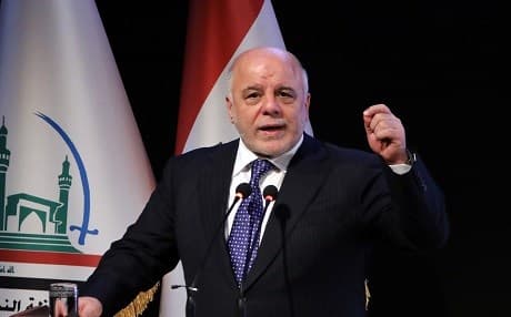 Iraqi Prime Minister Haider al-Abadi delivers a speech during a ceremony in the Shiite holy city of Najaf on January 7, 2018. He will run a rival campaign against his opponent Vice President Nouri al-Maliki. File photo: AFP/Haidar Hamdani