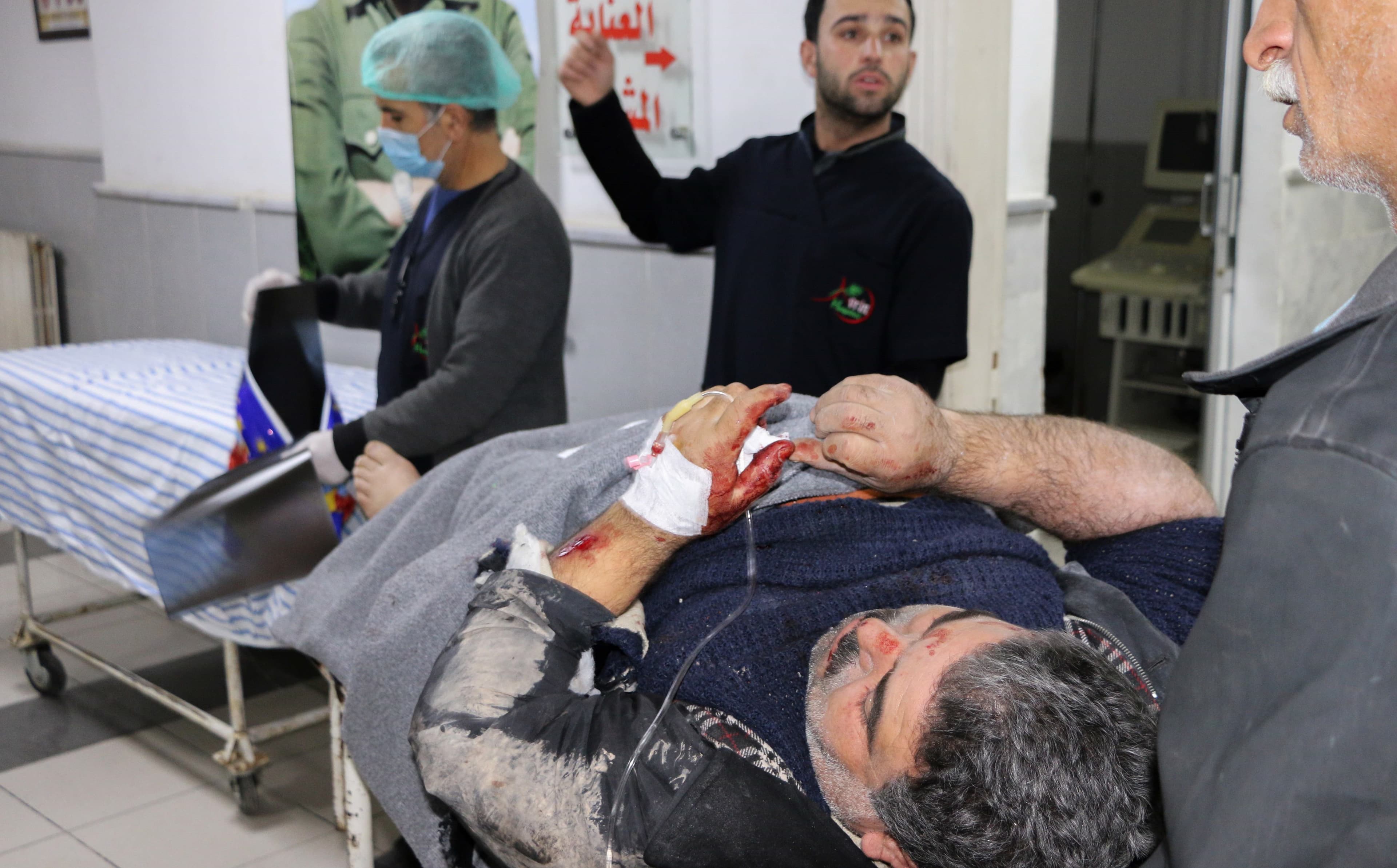 A wounded man lies on a stretcher in a hospital in Afrin on Tuesday. Photo: Ahmad Shafia Bilal/AFP