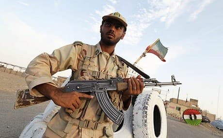 An Iranian soldier stands guard at a border point. File photo: Atta Kenare/AFP