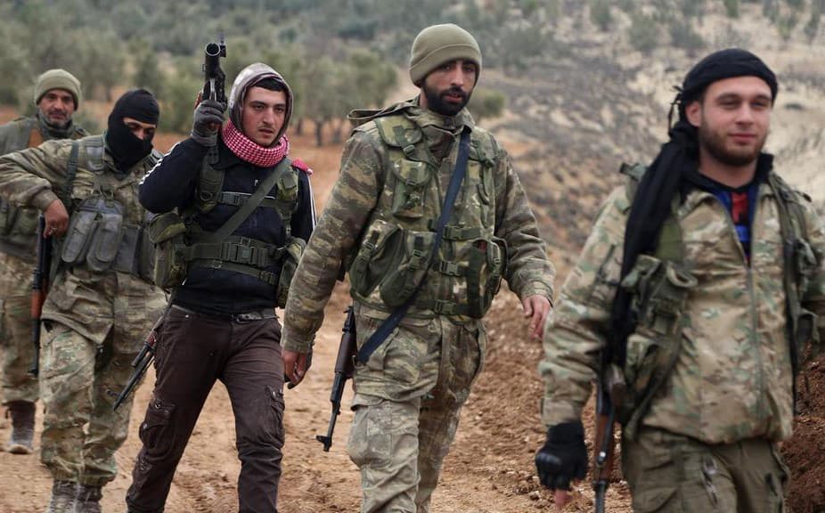 Turkish-backed Syrian militiamen seen in the Barsaya Hill area on Wednesday. Photo: Nazeer al-Khatib/AFP