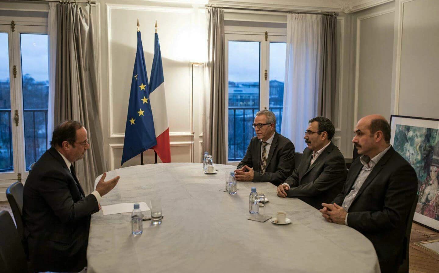 Former French president Francois Hollande speaks with a delegation from Rojava led by Aldar Khalil, co-president of TEV-DEM, (centre right), on Friday. Photo: PYD