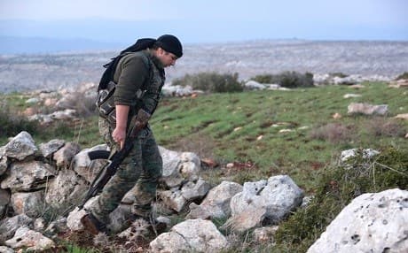 A Syrian Kurdish fighter walks in the town of Rajo in the Afrin District on January 27, 2018. Photo: AFP | stringer