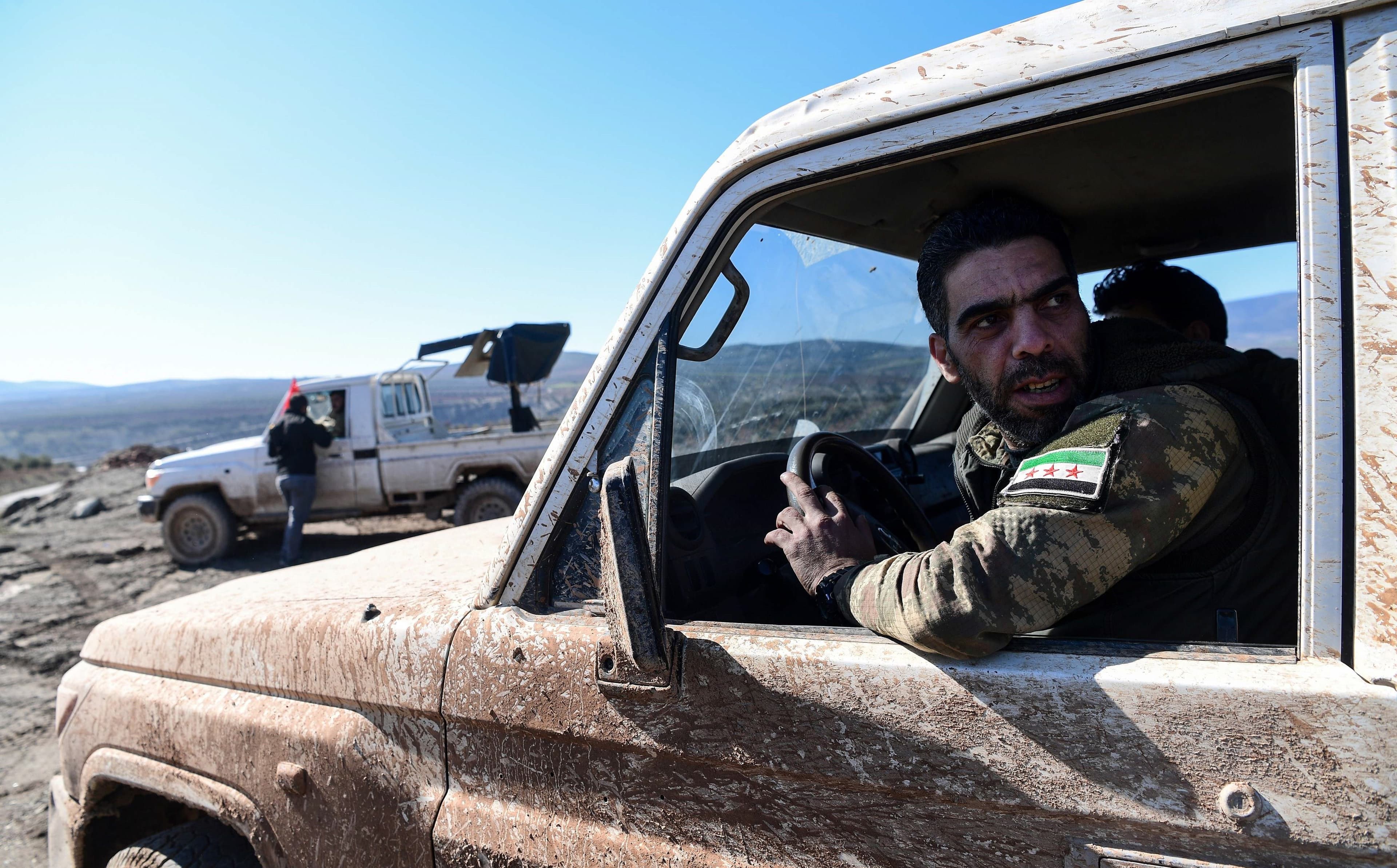 Turkish-backed Syrian rebel fighters seen on the Turkey-Syria border on Tuesday. Photo: Ozan Kose/AFP