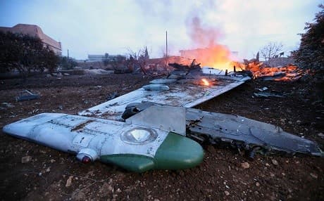  A picture taken on February 3, 2018, shows smoke billowing from the site of a downed Sukhoi-25 fighter jet in the the Syrian city of Saraqib, southwest of Aleppo. Rebel fighters shot down a Russian plane over Syria's northwest Idlib province and captured its pilot, the Syrian Observatory for Human Rights said.  / AFP / Omar Haj Kadour