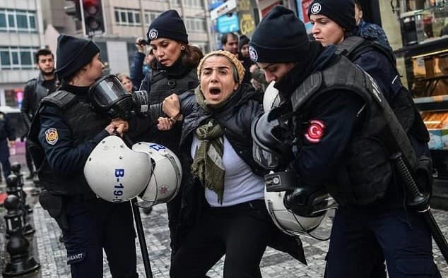 Turkish riot police arrested a woman at a rally protesting the military operation in Afrin in January. File photo: AFP