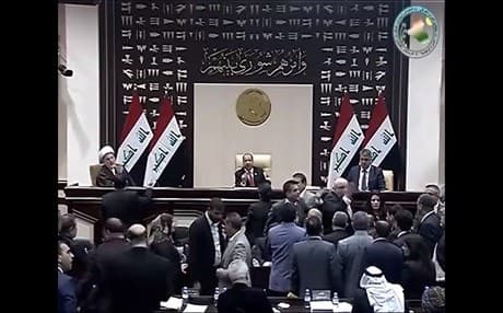 Kurdish MPs and others approach the podium of parliament speaker, Salim al-Jabouri, in Baghdad on February 7, 2018. Photo: Iraq parliament