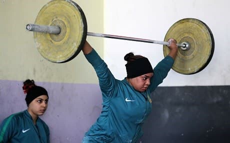 Iraqi weightlifter Khadeeja Ismal Abdullah, trains on January 18, 2018 at a club in Sadr City, east of Baghdad. Photo: Ahmed al-Rubaye | AFP
