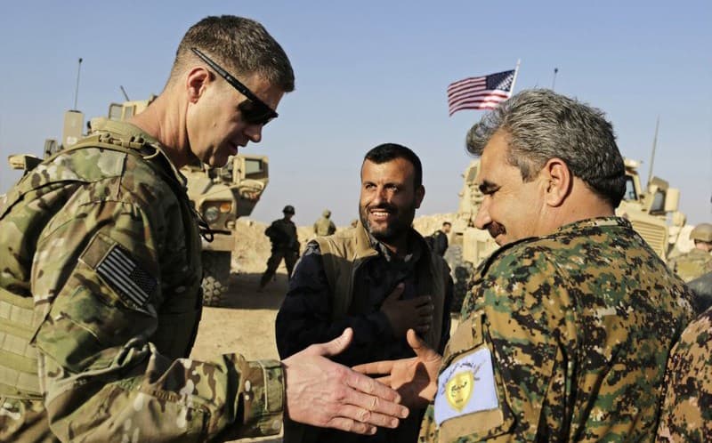 US Army Maj. Gen. Jamie Jarrard shakes hands with commander of the Manbij Military Council Muhammed Abu Adeel last week. Photo: Susannah George/AP 