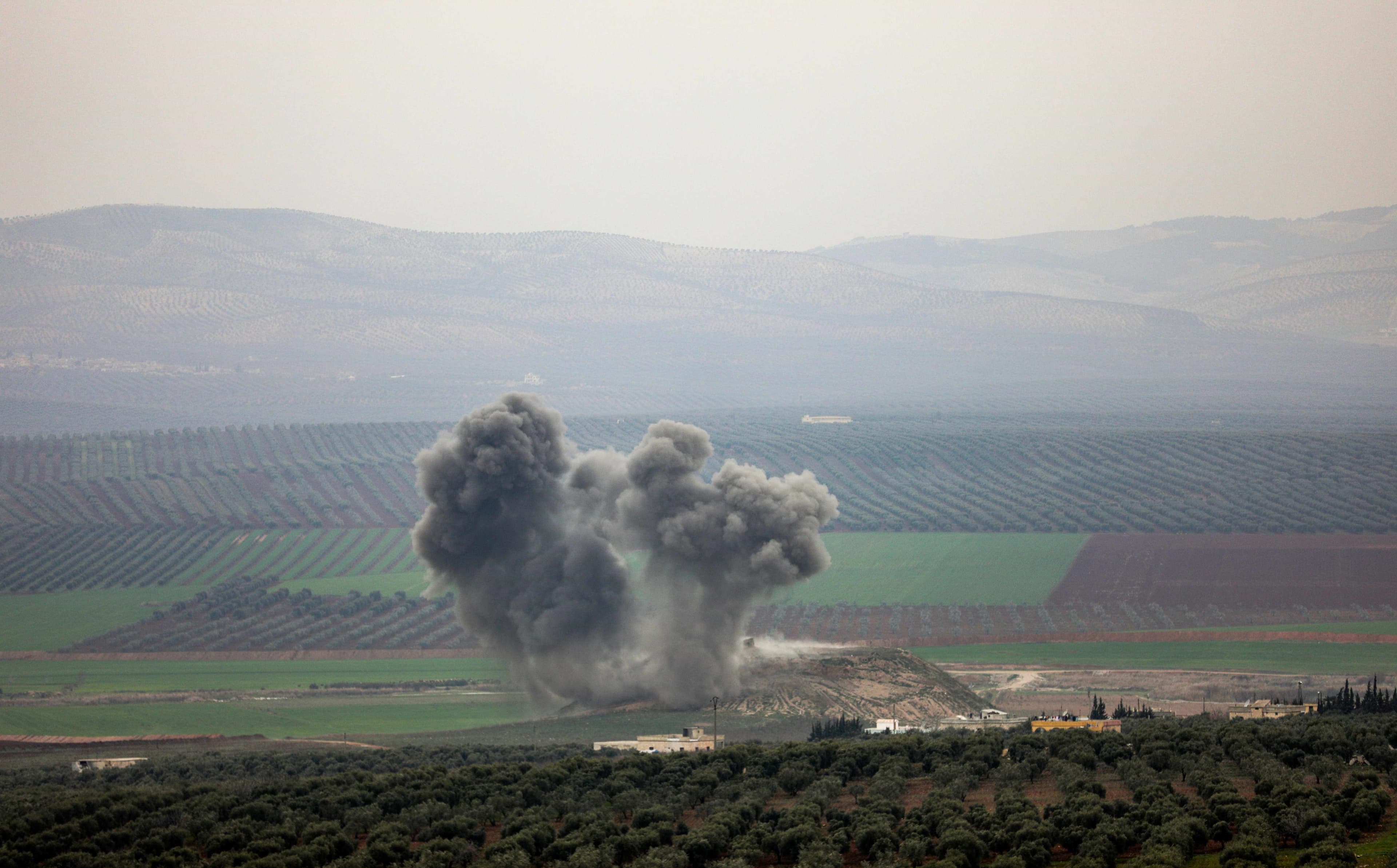 Smoke rises over the southern Afrin village of Deir Ballut after Turkish airstrikes on Saturday. Photo: Omar Haj Kadour/AFP
