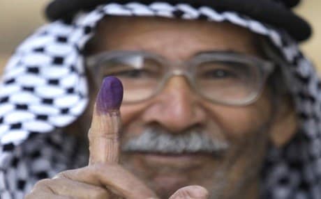 An Iraqi man displays an ink-stained finger after voting in provincial elections in central Baghdad on January 31, 2009. Photo: Hadi Mizban | AP