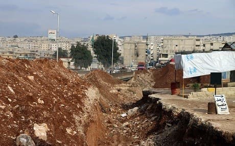 A picture taken on March 2, 2018, shows a trench dug in Afrin in preparation for any Turkish ground military operations. Photo: Ahmad Shafie Bilal | AFP