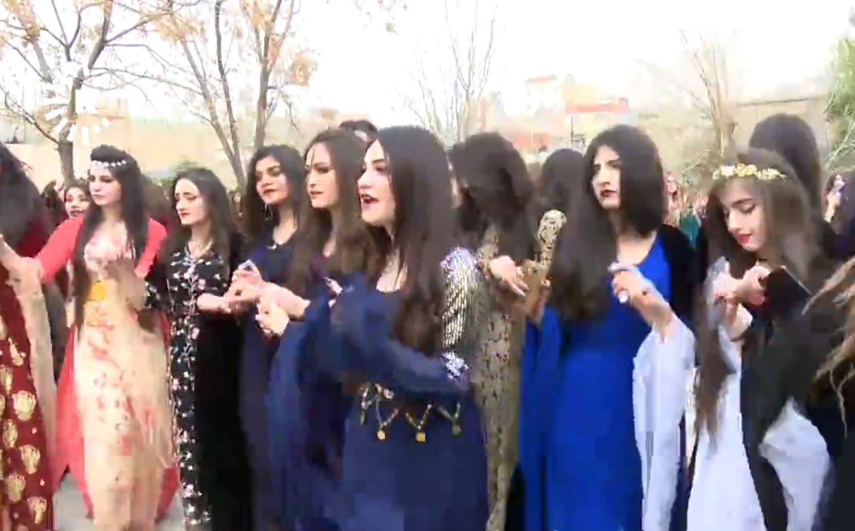 Students in Duhok dance as they celebrate Kurdish Clothes Day and International Women's Day. Photo: Rudaw TV