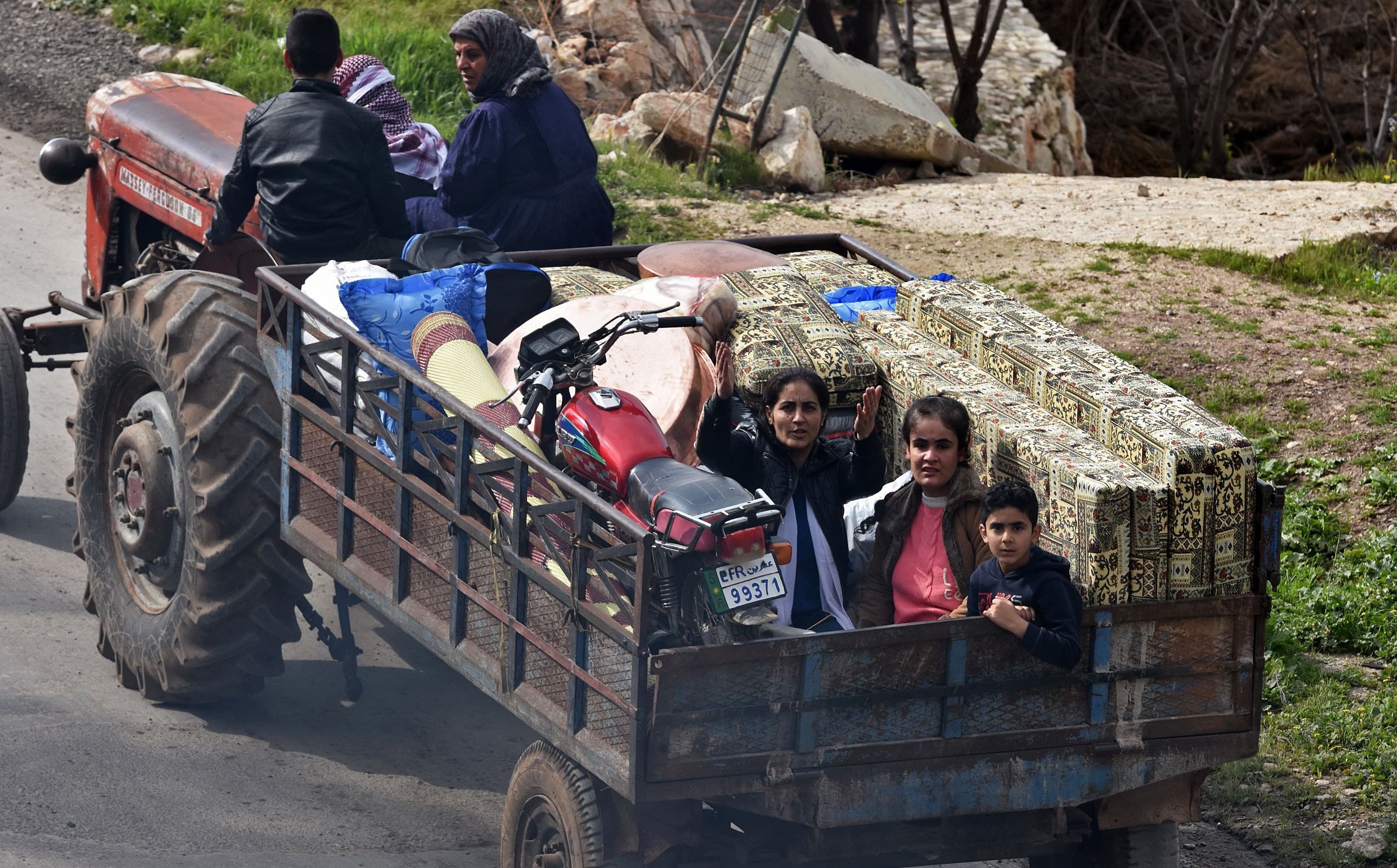Kurds flee the city of Afrin this week as Turkish forces and Syrian militias approach. Photo: George Ourfalian/AFP