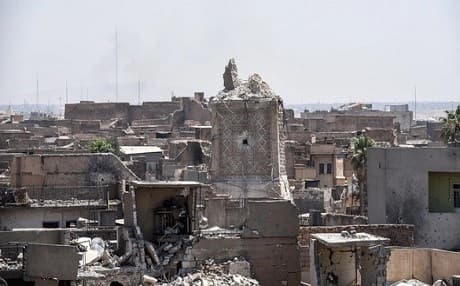 A picture taken on June 25, 2017, shows Mosul's destroyed ancient leaning minaret, known as the "Hadba" (Hunchback), in the Old City after being blown up by ISIS fighters earlier in the week. Photo: Mohamed el-Shahed | AFP