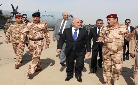 Iraqi Prime Minister Haider al-Abadi walks on the tarmac at Mosul Airport on March 14, 2018. Photo: GoI