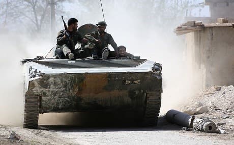 Syrian pro-regime forces advance on the outskirts of Ain Tarma in Eastern Ghouta as they continue to press their offensive to capture the rebel-held enclave on the doorstep of Damascus on March 21, 2018. Photo: AFP | stringer
