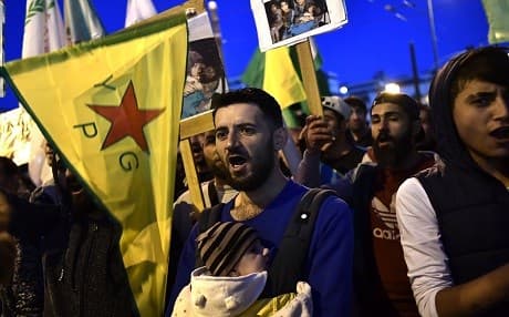Members of the Kurdish minority in Greece protest outside the Turkish consulate in central Athens on March 20, 2018, against Turkey's incursion to the Syrian city of Afrin and in solidarity with the people of Afrin. Photo: Aris Messinis/AFP