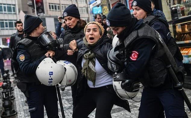 Turkish riot police arrested a woman at a rally protesting the military operation in Afrin in January. File photo: AFP