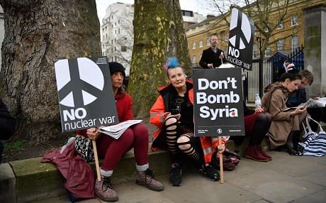 Anti-war protesters demonstrate against possible UK involvement in military action against Syria at Downing Street in London on Friday. Photo: Ben Stansall/AFP