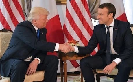 US President Donald Trump shakes hands with French President Emmanuel Macron. AFP file photo