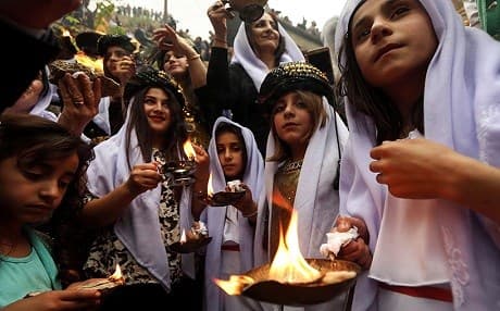 Yezidi women and girls light fires to celebrate Chawrshama Soori, their new year in 2017. File photo: AFP