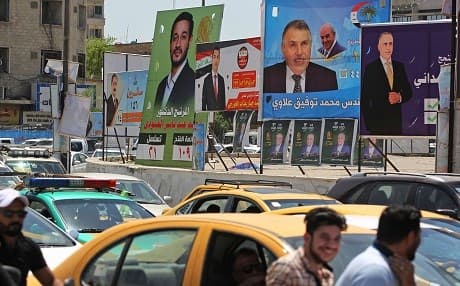 Campaign posters are seen in Baghdad this week. Photo: Ahmad al-Rubaye/AFP
