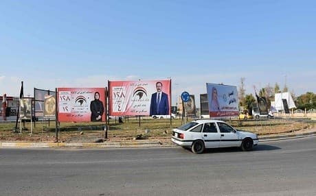 A picture taken on April 14, 2018 in Kirkuk shows campaign billboards for candidates in the upcoming parliamentary elections. Photo: Marwan Ibrahim  | AFP